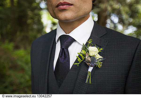 Midsection of bridegroom in full suit