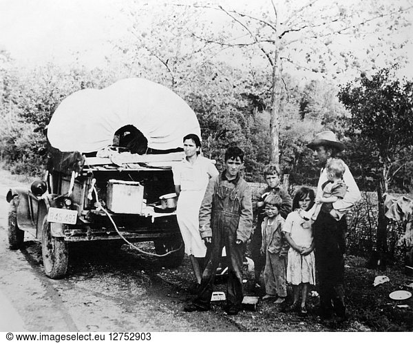 MIGRANT WORKERS  c1930. A family of fruit pickers from Oklahoma en route to Arkansas. Photograph  c1930