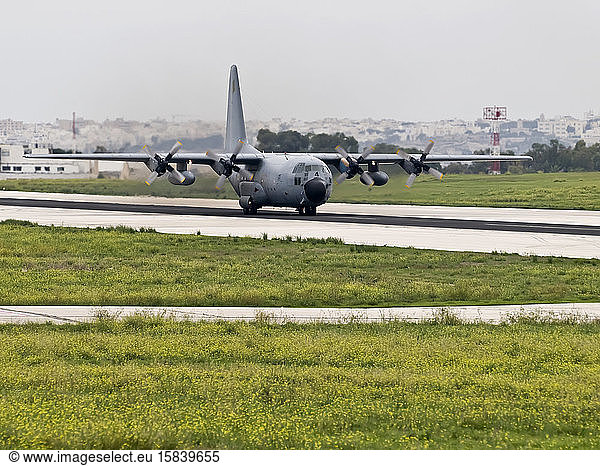 Military logistics aircraft on runway at Luqa airfield in Malta