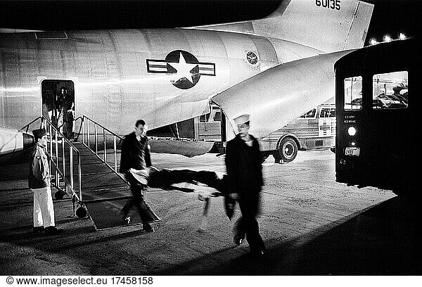 Military Staff carrying wounded Serviceman on Stretcher from Airplane after arriving from Vietnam  Andrews Air Force Base  Maryland  USA  Warren K. Leffler  US News & World Report Magazine Collection  March 8  1968