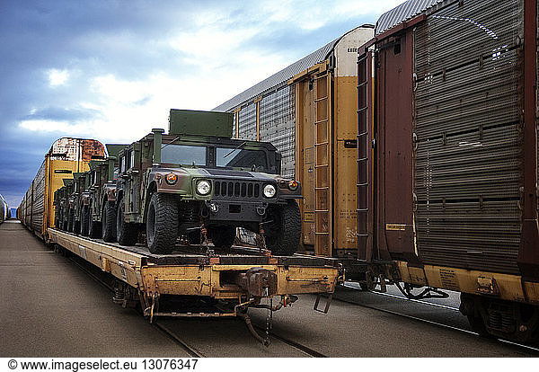 Military vehicles loaded on train