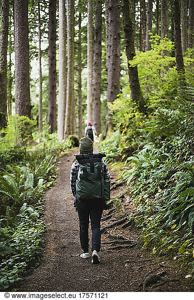Millenial Woman walking nature trail in Oregon