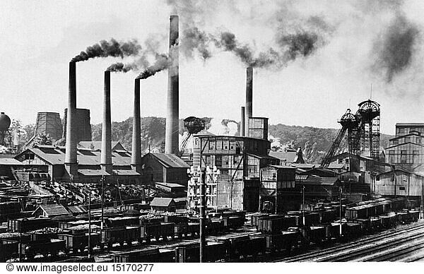 mining  coal mining  Reden mine  Schiffweiler  20th century  Germany  Saarland  hard coal  pit coal  bituminous coal  black coal  coal  coals  chimney  chimneys  fume  fuming  smoking  smoke  goods wagon  freight cars  goods wagons  boxcars  boxcar  box car  gondola  freight car  coal-mine  mining company  coal mining  mining industry  opencast mining  open-pit mining  open-cut mining  underground mining  deep mining  railway  railroad  railways  railroads  track vehicle  track vehicles  driving machine  vehicle  vehicles  means of transportation  means of transport  conveyance  transport  transportation  mine  mines  historic  historical