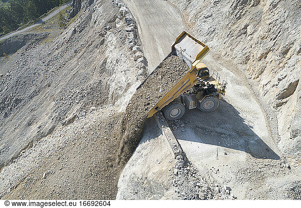 mining tractor unloading from aerial view