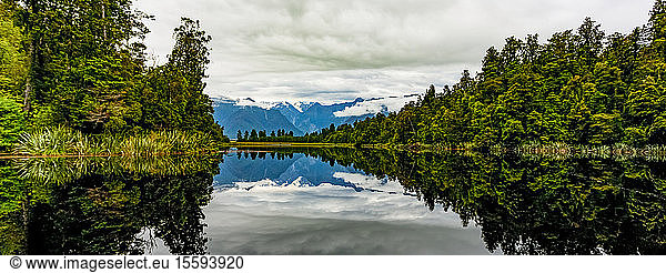 Mirror image of landscape into Lake Matheson; South Island  New Zealand