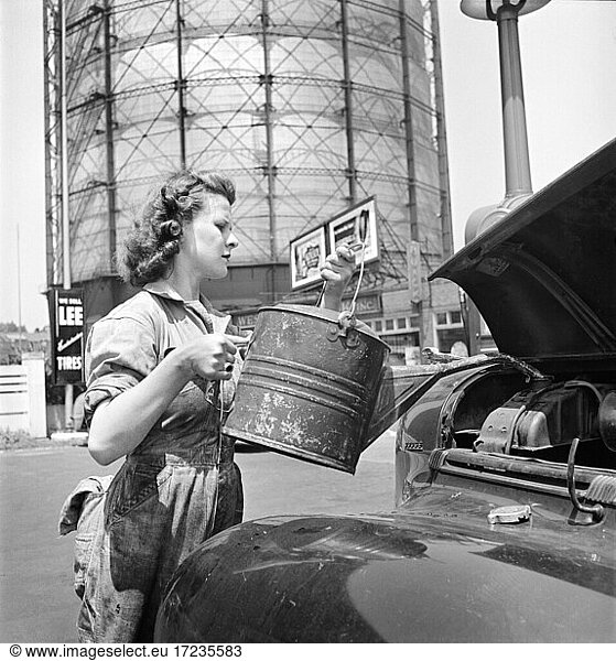 Miss Ruth Gusick  formerly a clerk in a drugstore  now works as a garage attendant at one of the Atlantic Refining Company Garages  Philadelphia  Pennsylvania  USA  Jack Delano for Office of War Information  June 1943
