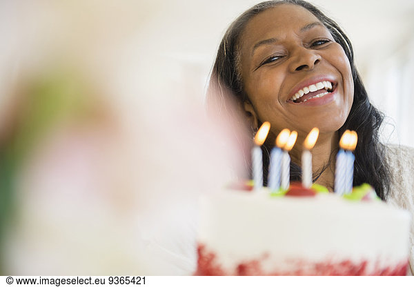 Mixed race woman celebrating birthday