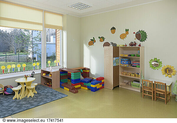 Modern children's day care or pre-school building  open indoors play area