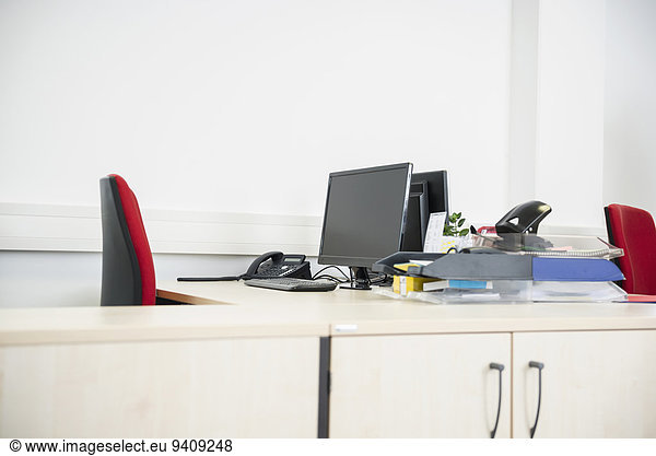 Modern empty office desk computer monitor
