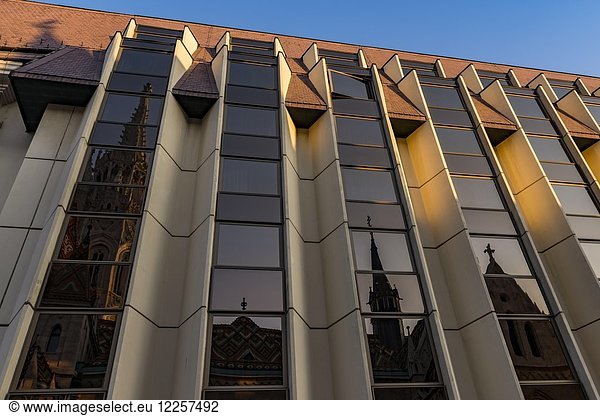 Modern facade of the Hilton Hotel with reflection of the Mathias Church  Budapest  Hungary  Europe