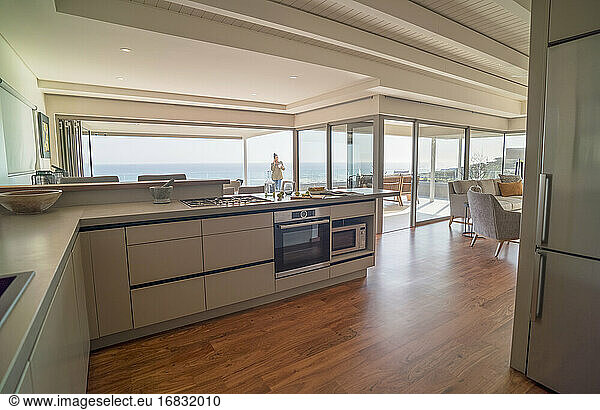 Modern home showcase interior kitchen with sunny ocean view