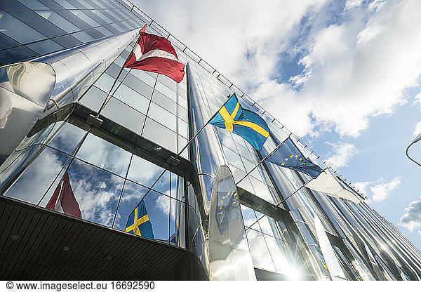 Modern hotel facade with scandinavian and EU flag