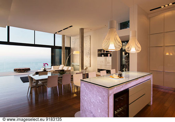 Modern kitchen and living area overlooking ocean