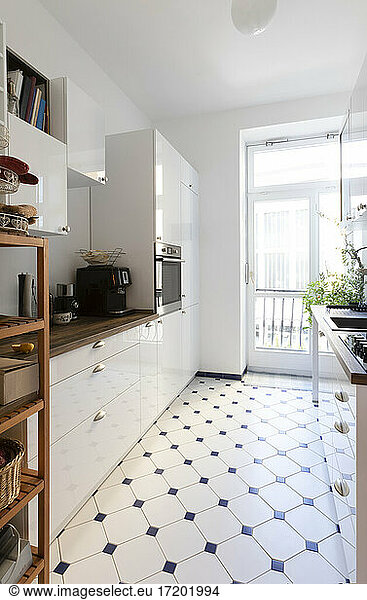 Modern kitchen with patterned flooring at home