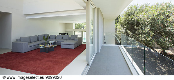 Modern living room open to balcony