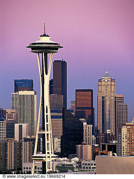 Modern Seattle skyline at sunset  including space needle and skyscrapers.