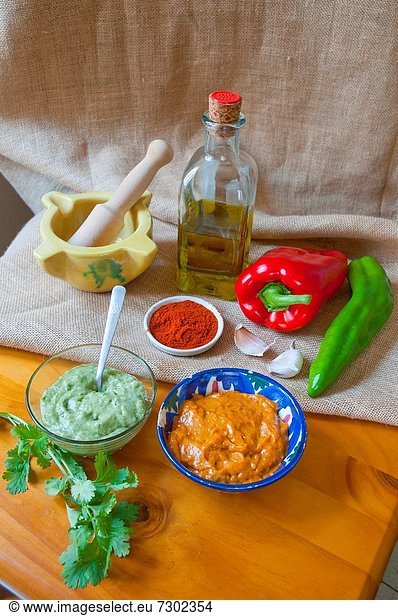 Mojo verde and mojo rojo sauces with ingredients. Canary Islands  Spain.