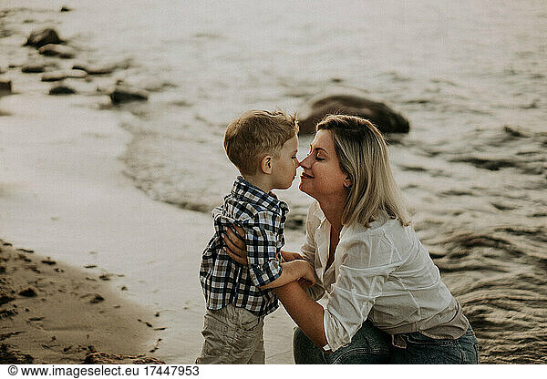 mom and son hugging on the seaside