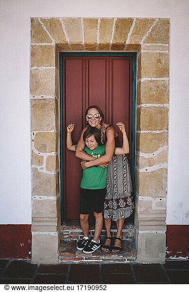 Mom and Son share a hug in an Old Spanish Doorway