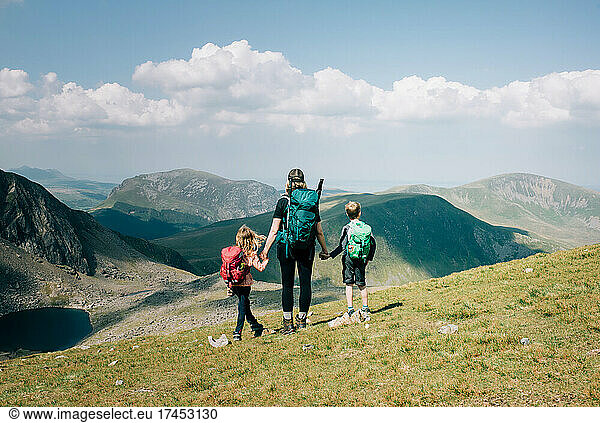 mom taking a moment with her kids to enjoy the view of Mount Snowdon