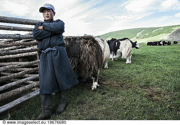 Mongol nomad boy at yak stable  Bulgan  Central Mongolia  Mongolia
