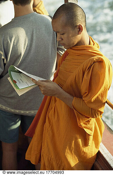Monk Read On The River Ferry  Bangkok  Thailand.