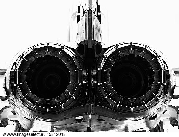 Monochrome detail of afterburners on military jet aircraft