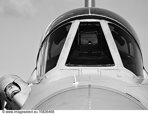 Monochrome detail of cockpit canopy on jet fighter aircraft