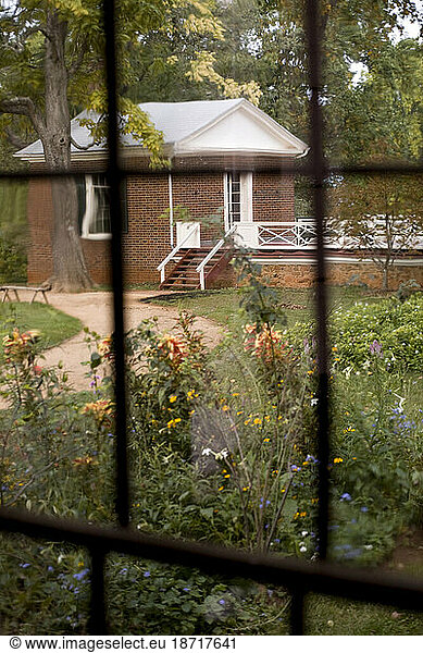 Monticello estate as seen through a glass window pane.
