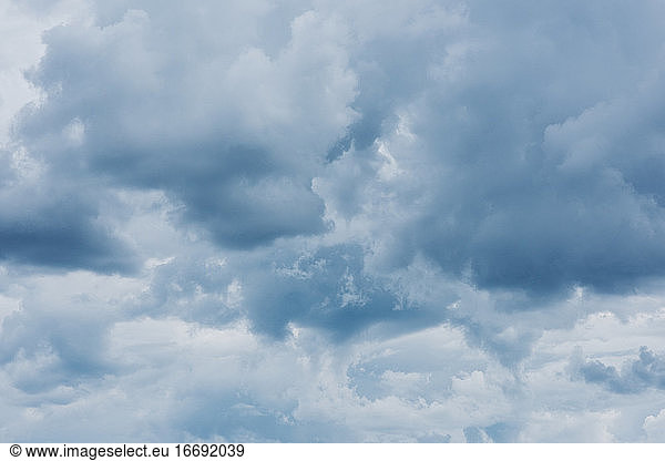 moody fluffy blue cloudscape in summer