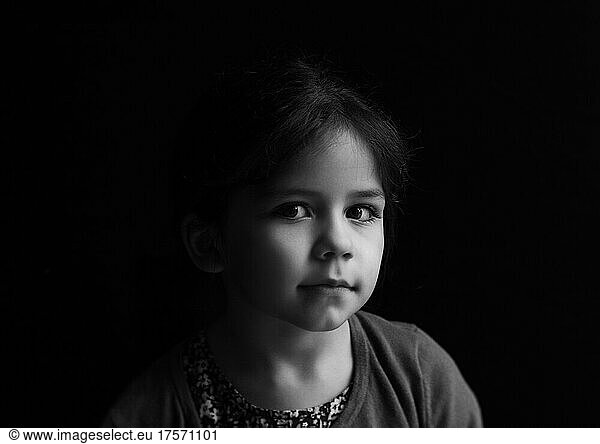 Moody portrait  shadows  child portrait  girl  black and white