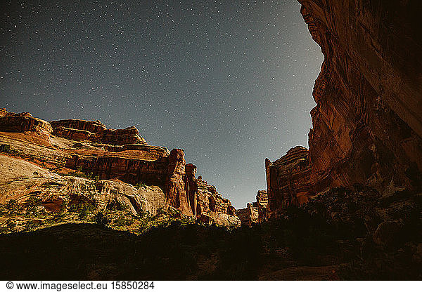 moonlight on the canyon walls under starry skies of the maze utah
