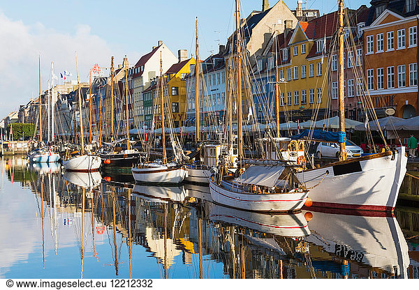 Moored boats and colourful 17th century town houses on Nyhavn canal  Copenhagen  Denmark