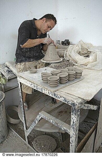 Moroccan Potter At Work Turning At The Potters Pane And Shaping