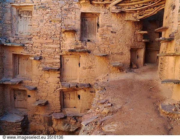 Morocco - Inside the perfectly preserved agadir = fortified granary of Tasguent in the Anti-Atlas mountains in southwest Morocco The grain chambers are reached by perilous looking step treads