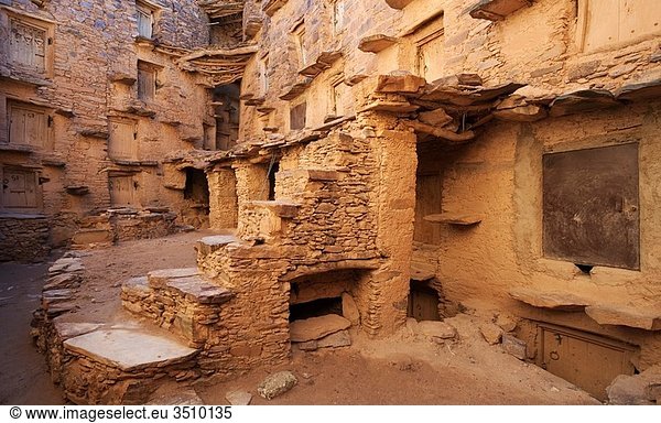 Morocco - Inside the perfectly preserved agadir = fortified granary of Tasguent in the Anti-Atlas mountains in southwest Morocco The grain chambers are reached by perilous looking step treads
