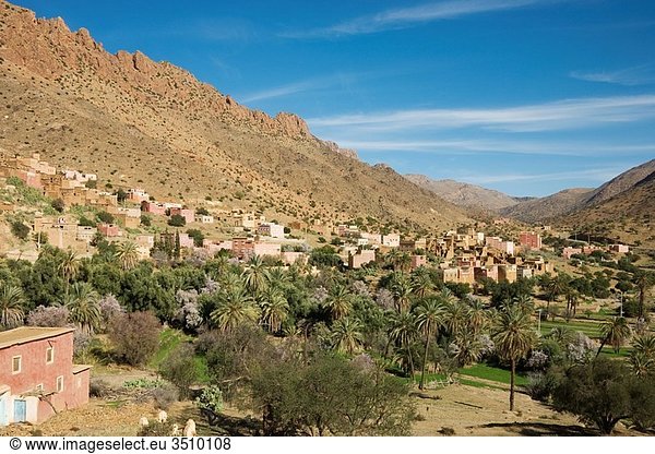 Morocco - The brightly painted houses of the Ameln villages are built on the lower slopes of the Djebel El Kest Ameln valley  Anti-Atlas mountains  Morocco