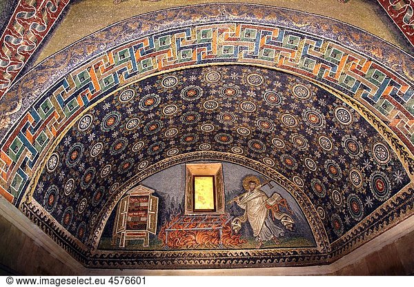Mosaics in the Mausoleo di Galla Placidia in Ravenna showing Saint Lawrence as deacon with cross  the fire on which he was martyred and the book of the four gospels