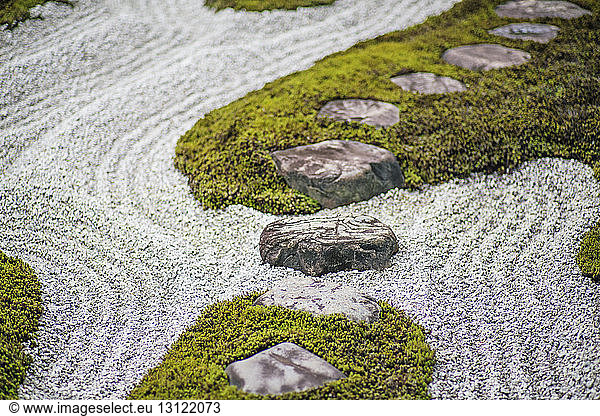 Moss and gravel in Japanese rock garden in temple