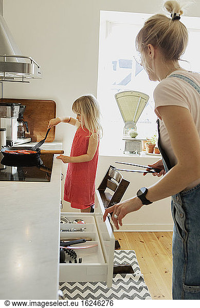 Mother and daughter in kitchen