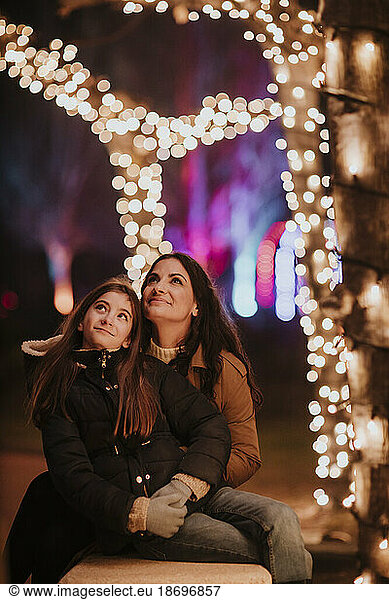 Mother and daughter looking at Christmas lights