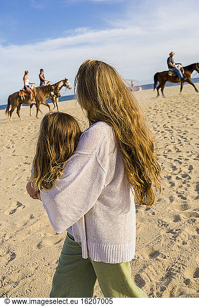 mother and daughter playing on beach  Cabo San Lucas  Mexico
