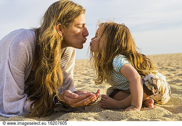 mother and daughter playing on beach  Cabo San Lucas  Mexico
