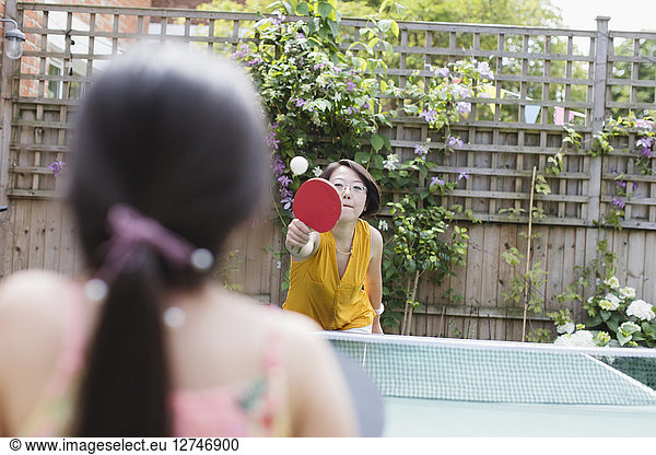 Mother and daughter playing table tennis