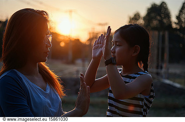 Mother and daughter playing together