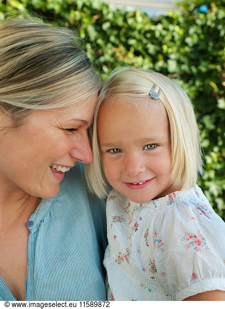 Mother and daughter  smiling  portrait