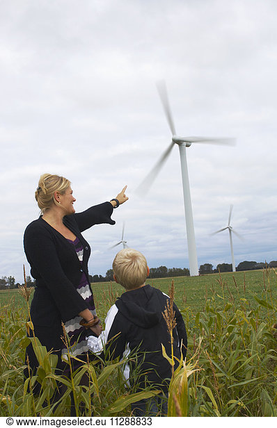 Mother and Son Looking at Wind Turbines  Denmark
