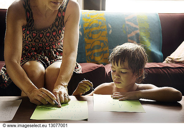 Mother and son playing indoors