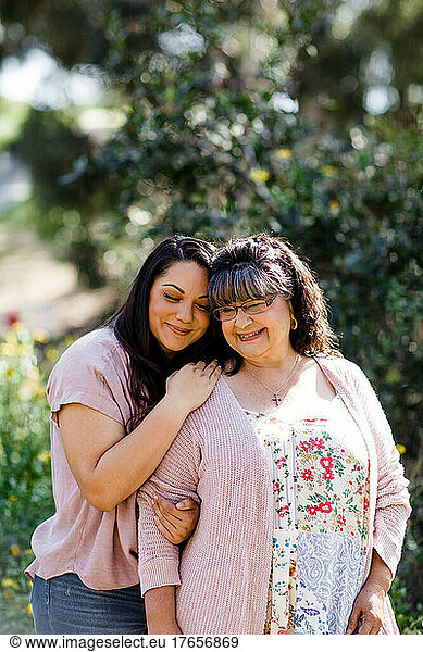 Mother & Daughter Embracing at Park in San Diego