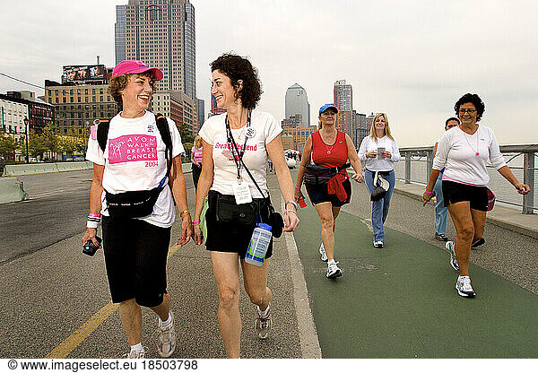 Mother/daughter surivor team walk in the Avon Walk for Breast Cancer in New York City.